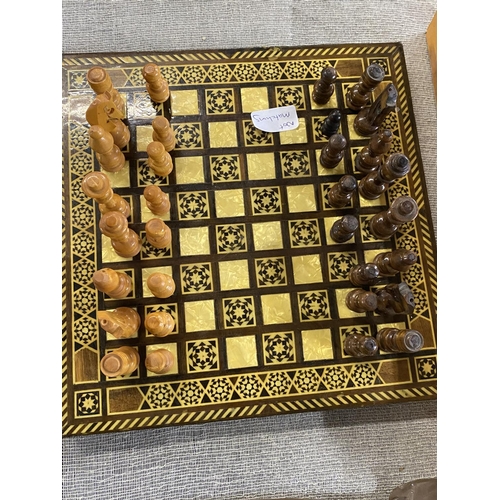 309 - Three assorted chess boards with matching pieces