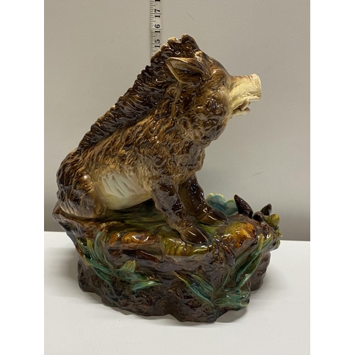 323 - A Majolica style planter with Wild Boar decoration h45cm, shipping unavailable