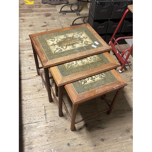 58I - A nest of three mid-century tile top tables, shipping unavailable