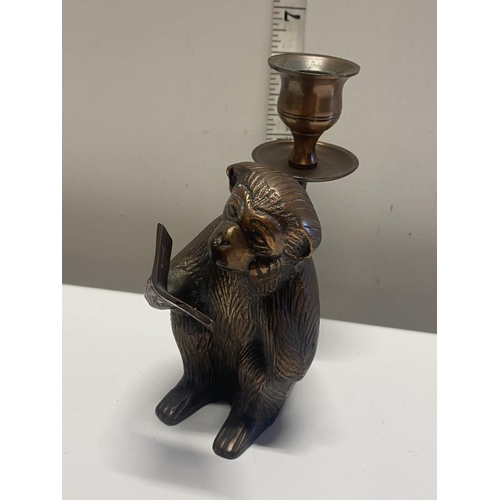 6 - A novelty brass candlestick in the form of a monkey.