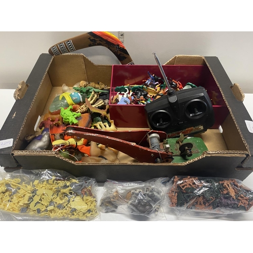 75 - A box full of assorted vintage plastic figures and other toys