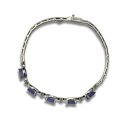 121A - A 18ct white gold Tanzanite & diamond bracelet. Gross weight 7.31 grams.