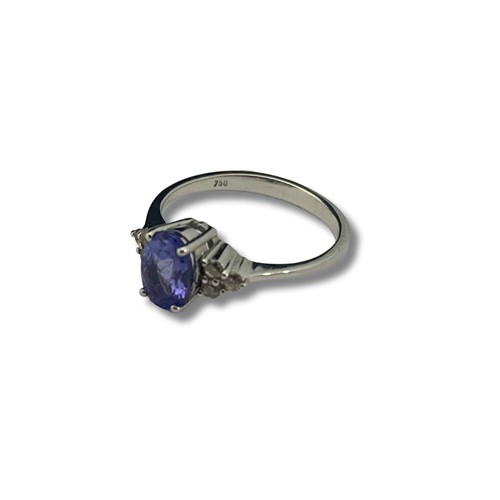 121B - A 18ct white gold Tanzanite & diamond ring. Gross weight 2.49 grams. Size J 1/2.