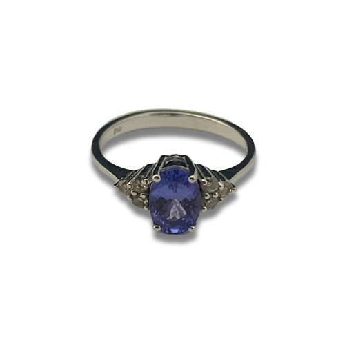 121B - A 18ct white gold Tanzanite & diamond ring. Gross weight 2.49 grams. Size J 1/2.