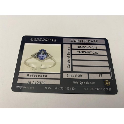 121B - A 18ct white gold Tanzanite & diamond ring. Gross weight 2.49 grams. Size J 1/2.