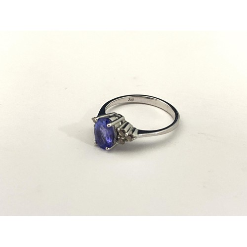 121B - A 18ct white gold Tanzanite & diamond ring. Gross weight 2.49 grams. Size J 1/2.