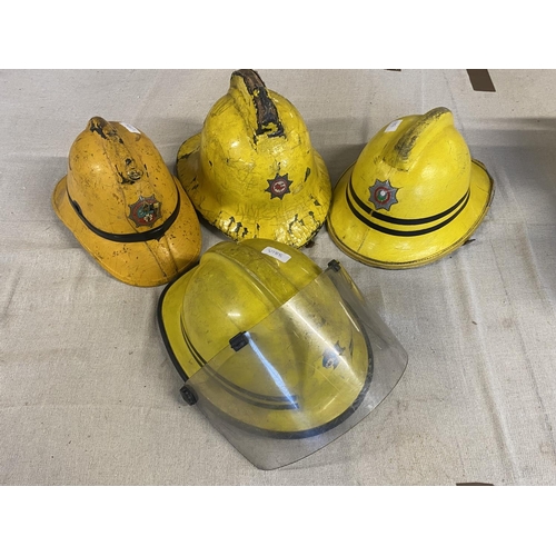 583 - Four vintage fireman's helmets, A/F, shipping unavailable