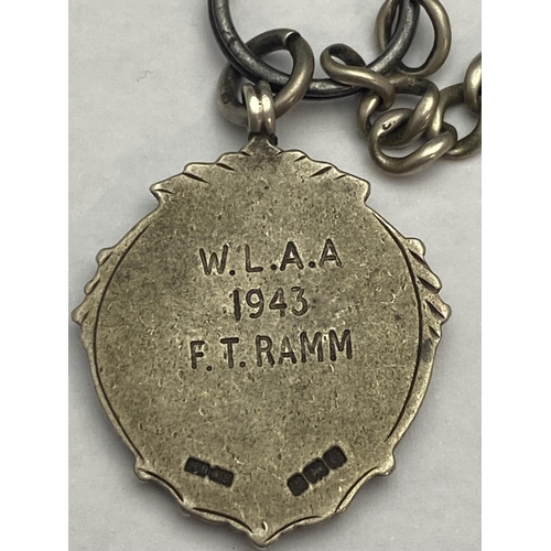 234 - A hallmarked silver Albert chain and fob 40.45g