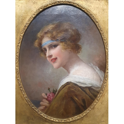 36 - A early 20th century oil on canvas depicting a portrait of a young lady holding a rose by French art... 