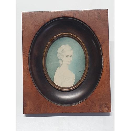 100 - A painted miniature portrait in a walnut frame of a young Georgian lady signed A Bonini, overall dim... 