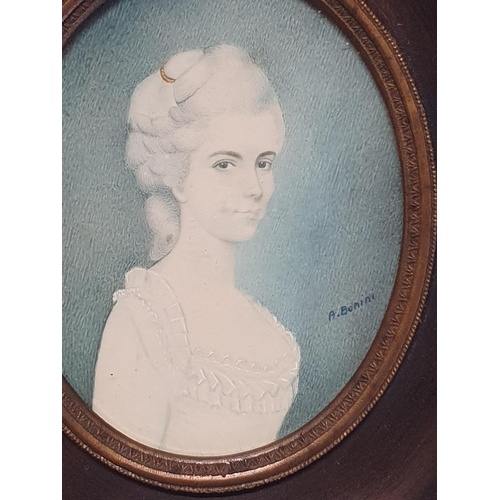 100 - A painted miniature portrait in a walnut frame of a young Georgian lady signed A Bonini, overall dim... 