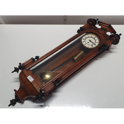 115 - A wooden cased Vienna wall clock complete with key and weight L84cm, shipping unavailable