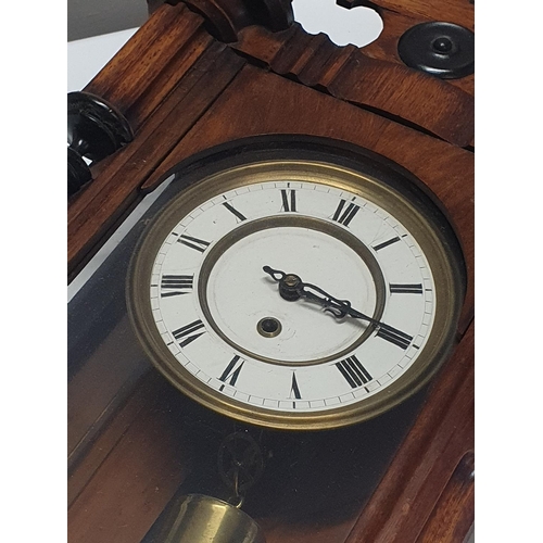 115 - A wooden cased Vienna wall clock complete with key and weight L84cm, shipping unavailable