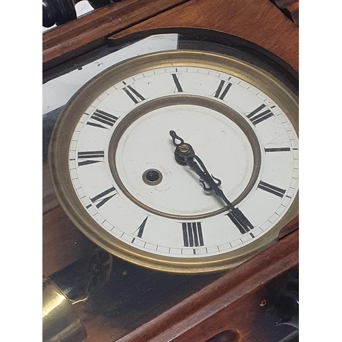 115 - A wooden cased Vienna wall clock complete with key and weight L84cm, shipping unavailable