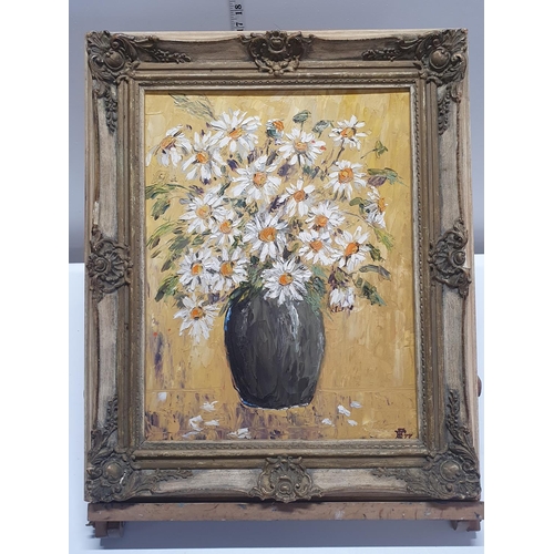 116 - A framed still life oil on canvas depicting daises in vase with monogram to bottom corner dated 77 a... 