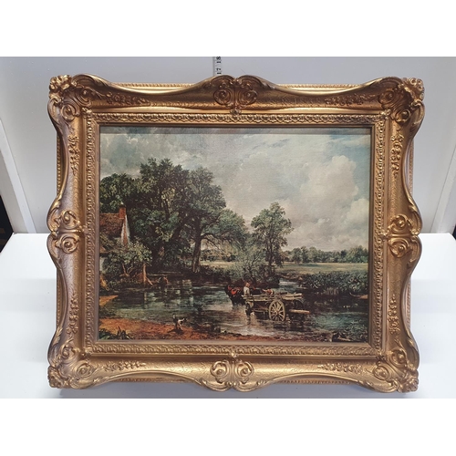 41 - A framed print of 'The Hay Wain' J Constable in a ornate gilt frame overall dimensions 57x64cm