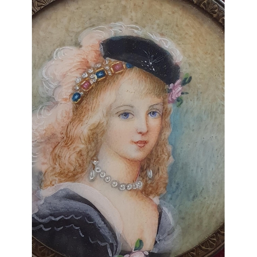 79 - A 19th century hand painted miniature portrait depicting a young French lady overall diameter 9cm