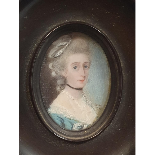 87 - A framed painted miniature portrait of a lady dated 1789 signed Read in a oval wooden frame overall ... 