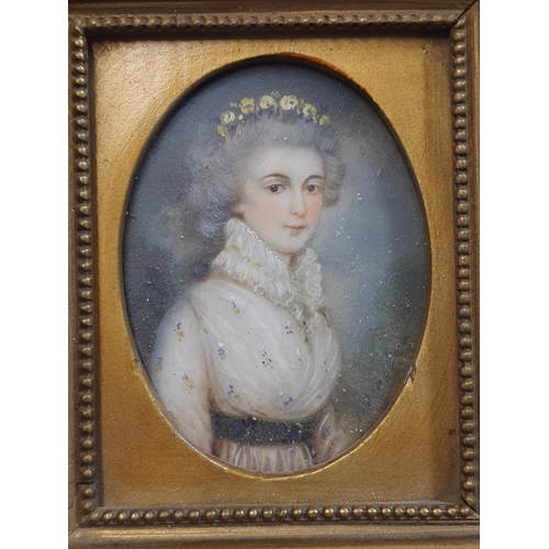 96 - A Georgian painted miniature portrait of a lady in a gilt framed (signature illegible) overall dimen... 