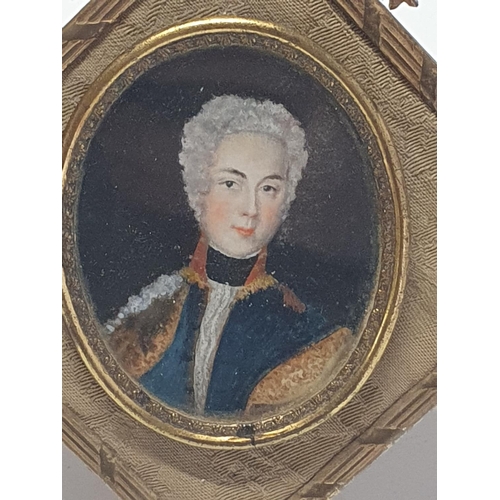 98 - A Georgian painted miniature portrait of a gentleman in a elaborate brass frame overall dimensions 1... 