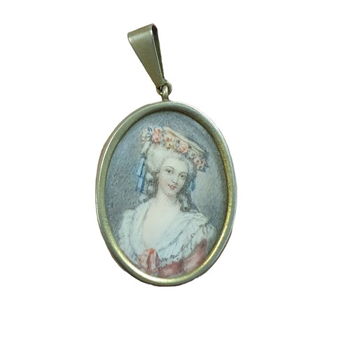 68 - A small hand painted miniature portrait of a Georgian lady in the form of a locket