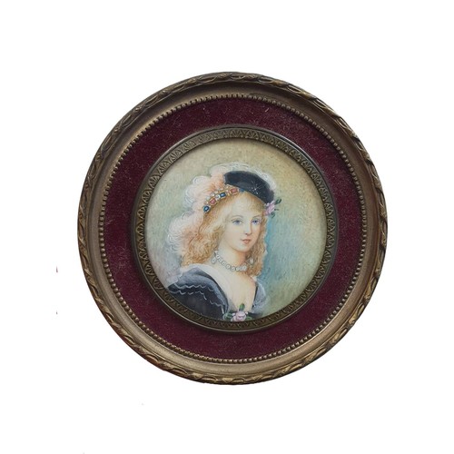 79 - A 19th century hand painted miniature portrait depicting a young French lady overall diameter 9cm