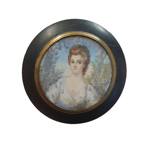 89 - A Georgian miniature painted portrait of lady in ebonized frame (signature illegible) overall diamet... 