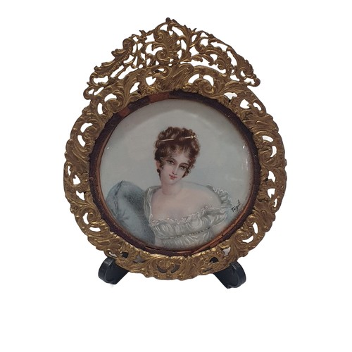 91 - A Georgian painted miniature of a lady in brass frame signed Tezil overall dimensions 12x10cm