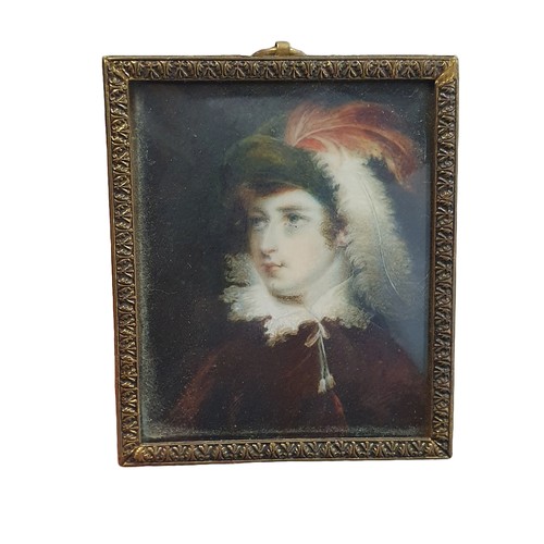 92 - A Georgian painted miniature portrait in a brass frame of a young lady with feathers in her hair, ov... 