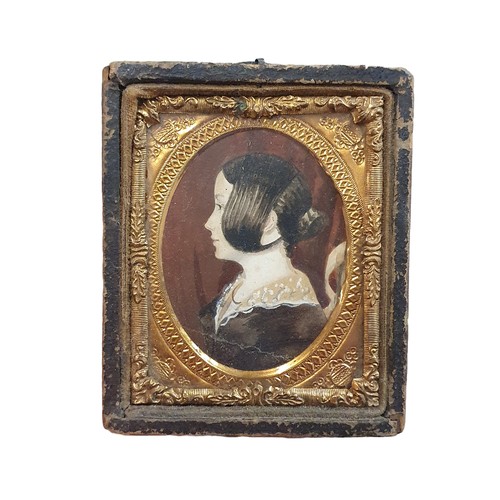 93 - A early Victorian framed miniature portrait of a lady possibly a memorial portrait with crests to fr... 