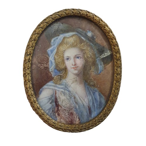 94 - A Georgian painted miniature portrait of a lady in oval brass frame overall dimensions 11x9cm