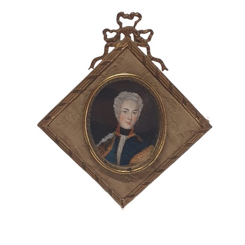 98 - A Georgian painted miniature portrait of a gentleman in a elaborate brass frame overall dimensions 1... 