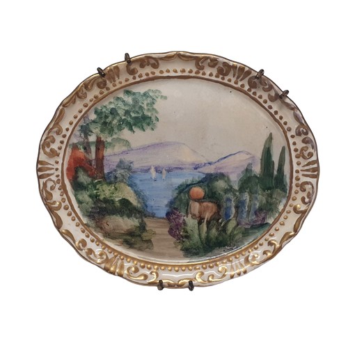 104 - A painted ceramic miniature of a landscape scene signed to reverse F Hogg overall dimensions 13x11cm