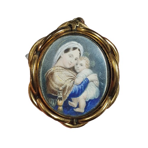 112 - A early 19th century painted miniature portrait depicting a mother and child in a ornate brass frame... 