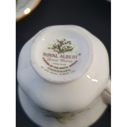 190 - A miniature Royal Albert, Elizabethan bone china tea set 'Calendar Months'. twelve cups and saucers.