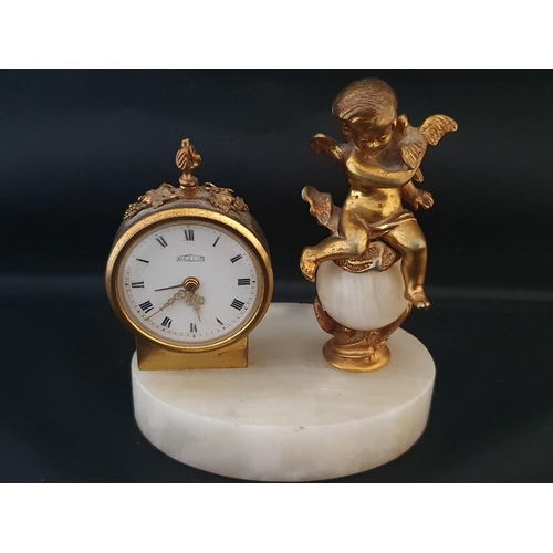 199 - A onyx Angelus brass clock with gilt cherub decoration