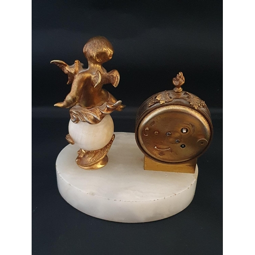 199 - A onyx Angelus brass clock with gilt cherub decoration
