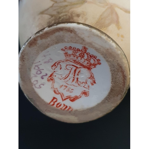 200 - A Royal Worcester figurine and a antique German Royal Bonn hand decorated vase