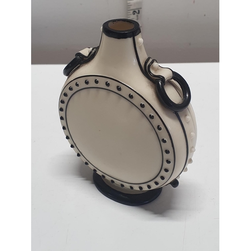 210 - A possibly early Royal Worcester moon shaped vase or 