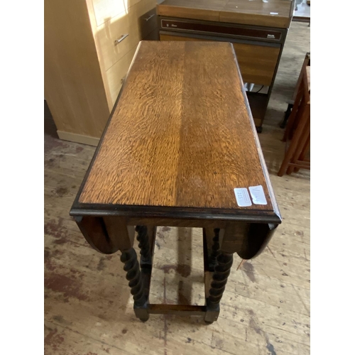 215 - A small antique oak gate leg barley twist table, shipping unavailable