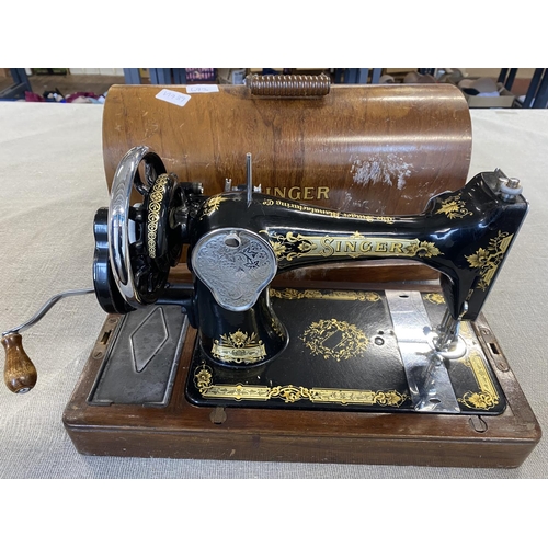 693 - A vintage Singer sewing machine, shipping unavailable