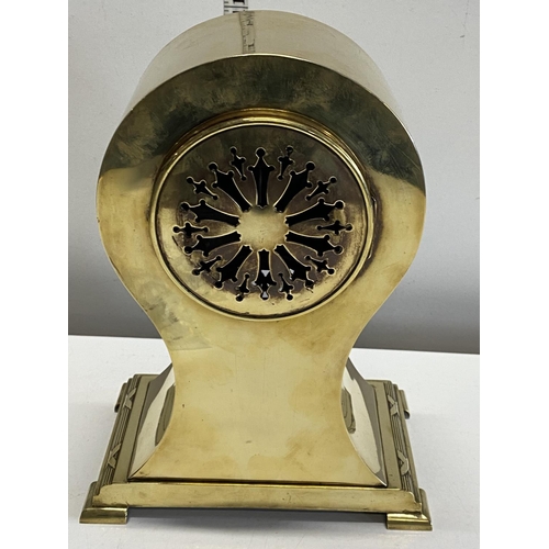 37 - A heavy early 20th century brass mantle clock with a French movement, Japy Freres with key H30cm, sh... 