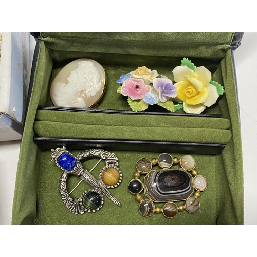 118 - A box full of assorted costume jewellery brooches etc