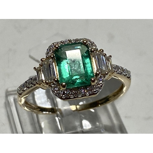 147 - A 9ct yellow gold Emerald and Moissonite ring size Q 2.67g