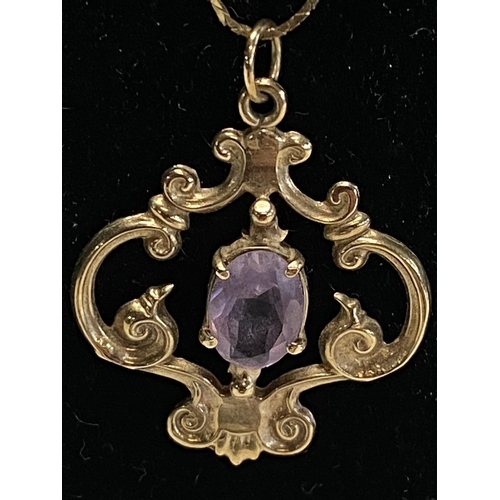 156 - A 9ct gold and amethyst pendant on a 9ct gold chain 3.83g