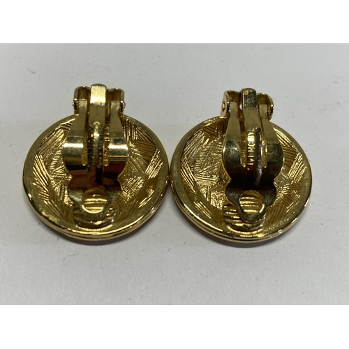 227 - A pair of vintage Givenchy gold tone clip on earrings