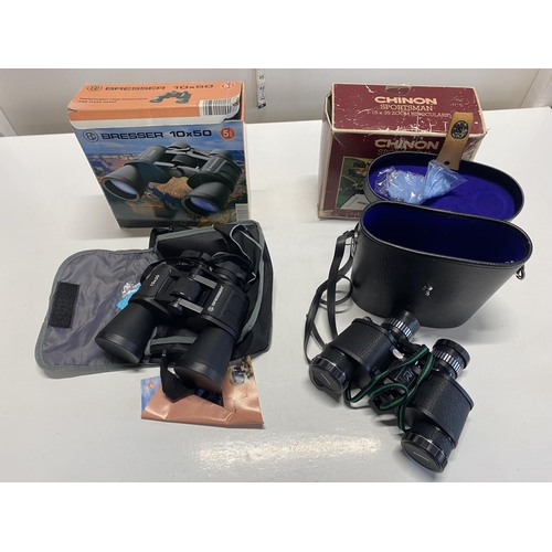 463 - Two boxed pairs of binoculars - Bresser 10x50 field binoculars and a pair of Chinon zoom binoculars