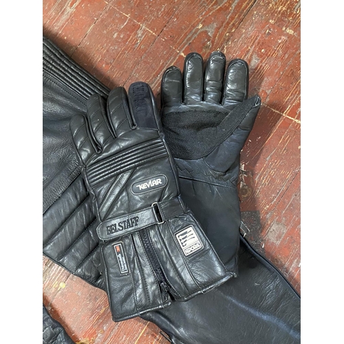 569 - A pair of Belstaff motorbike gloves, a vintage motorbike jacket and leather salopettes