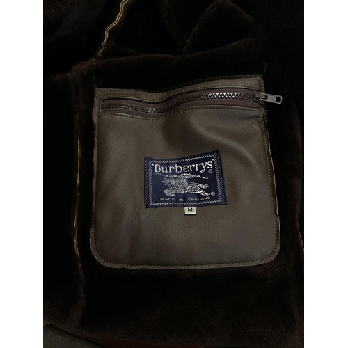 618 - A suede Duffle coat with a Burberrys Lable (unauthenticated) very good quality.