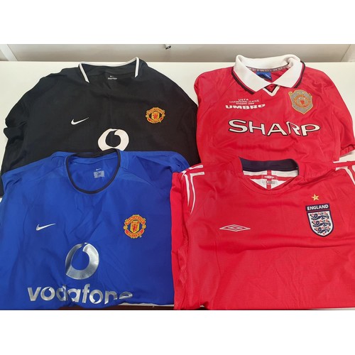 346 - A large selection of mainly new old stock Manchester United football shirts - mostly L and XL sizes ... 